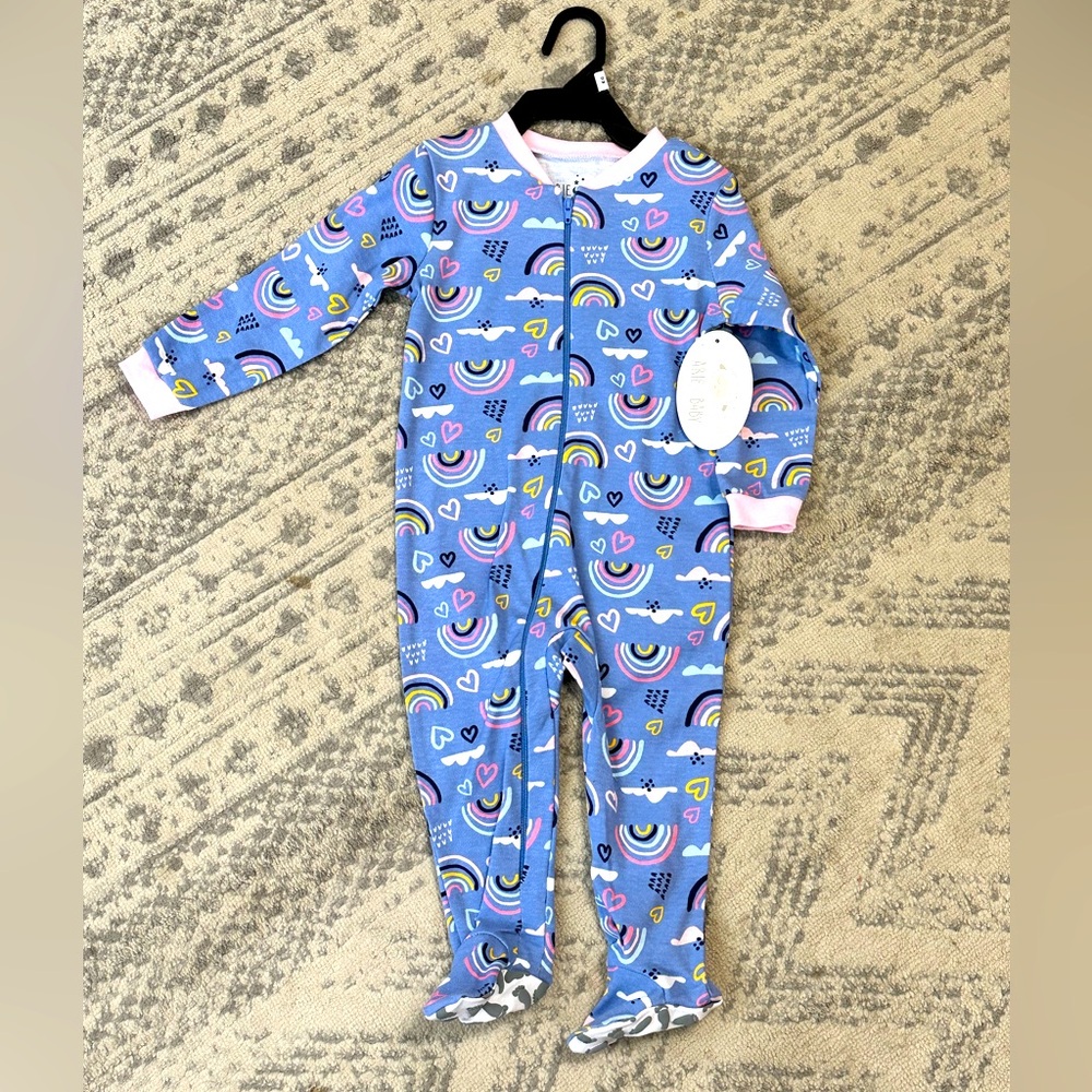 Baby onesie pajamas with rainbows